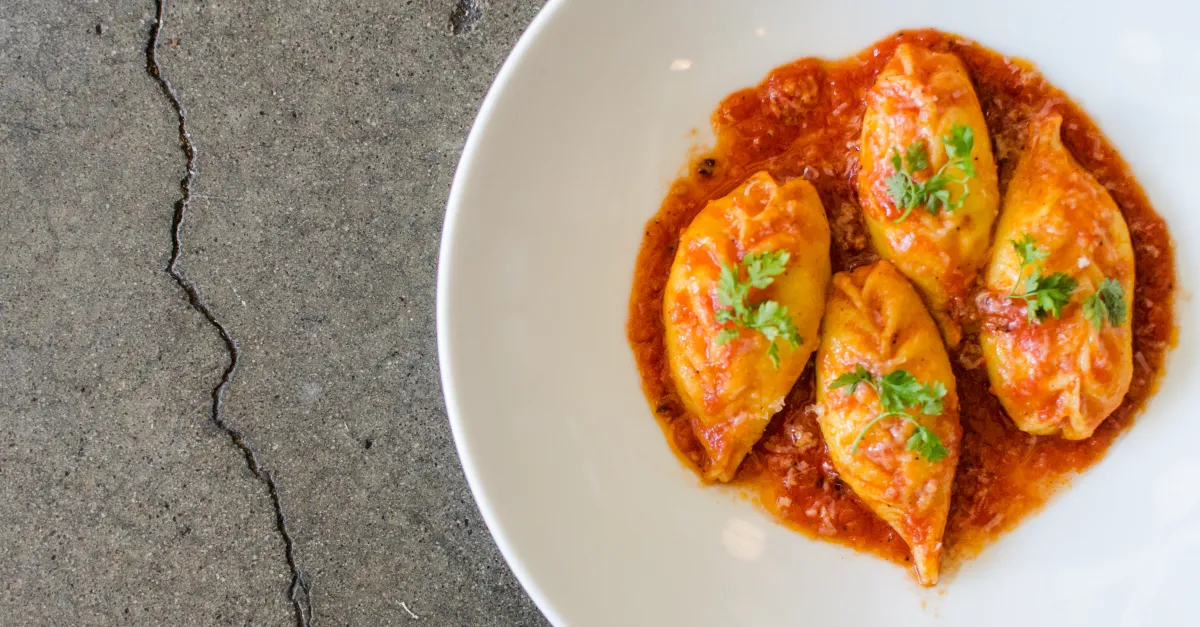 Bar Volpe signature dishes Spaghetti all'Amatriciana, Culurgiones (Sardinian stuffed pasta), Wood-fired seafood, Aperol Spritz slushy
